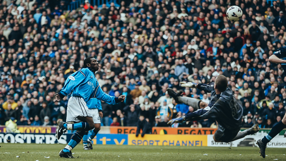 CHEEKY CHIP : Shaun Wright-Phillips completes the scoring against Coventry with a deft lob | 3 March 2002.