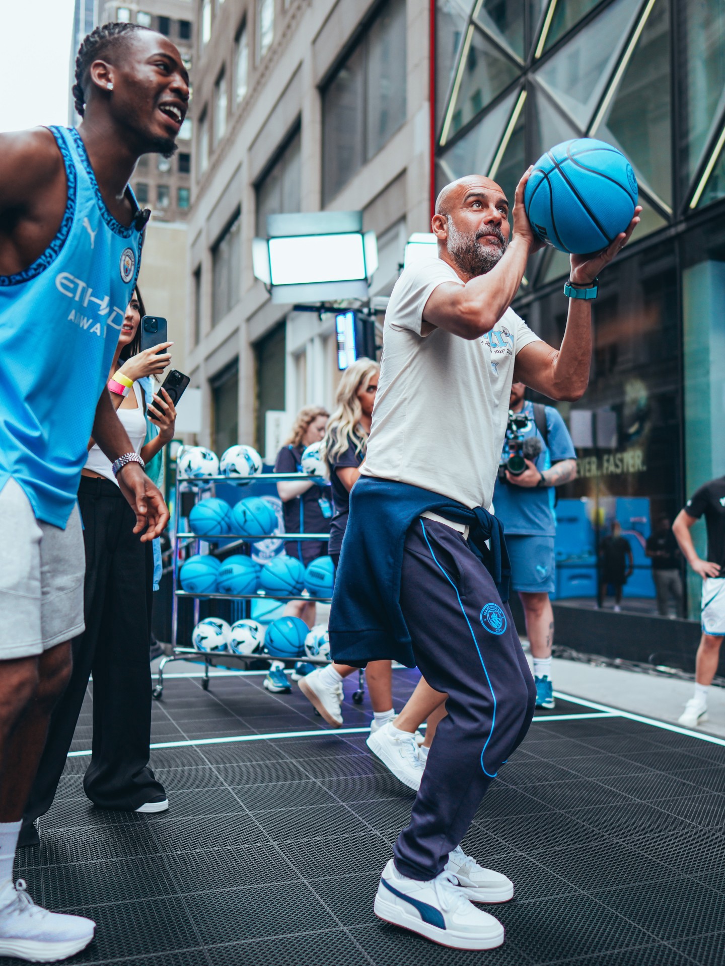 Man City star beam as he plays street basketball in New York in special outfit