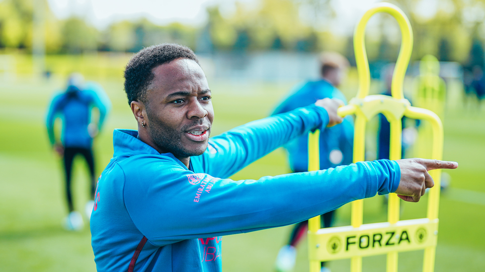 POINTING THE WAY : Raheem Sterling lines up the next training routine