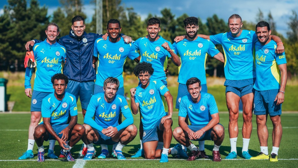 BACK TOGETHER : First-team players smile for the camera.