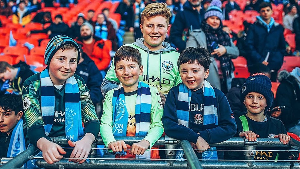 BLUE SHARP DRESSED YOUNG MEN: No doubting who these young fans are backing!