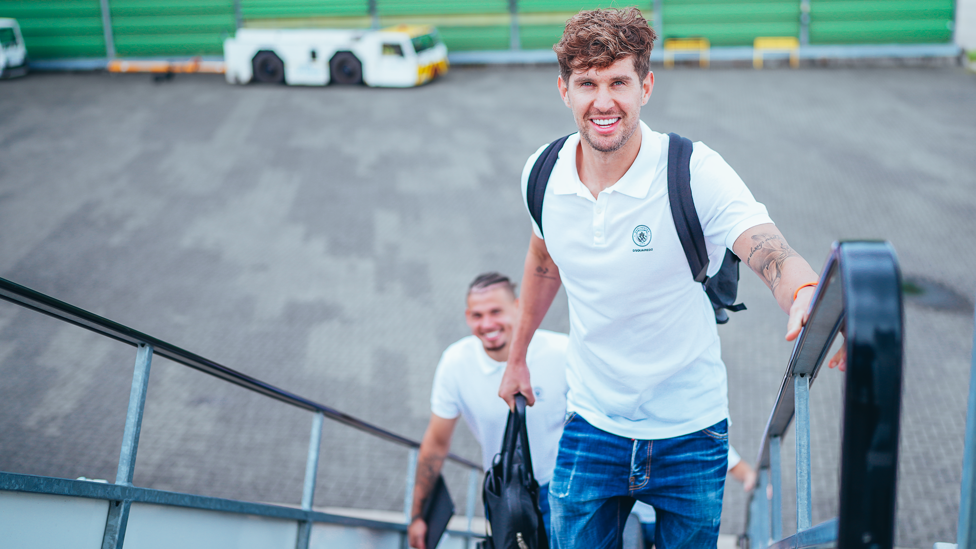 ALL ABOARD :  John Stones is closely followed by Kalvin Phillips onto the plane.