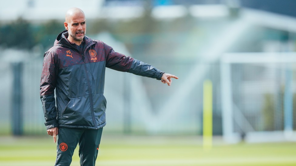 THIS WAY : Pep Guardiola hands out instructions. 