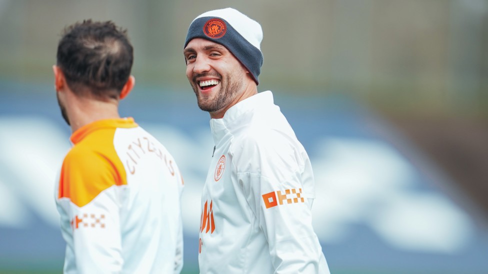 HAPPY CAMP : Mateo Kovacic shares a joke with Bernardo Silva