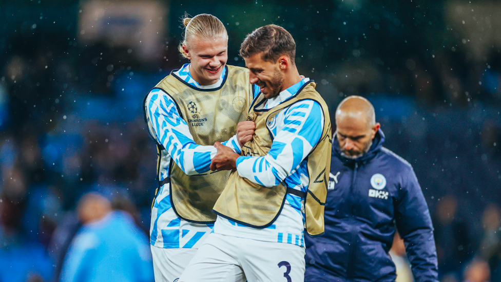 HAHA-HAALAND : Erling shares a chuckle with Dias during the pre-match warmup.