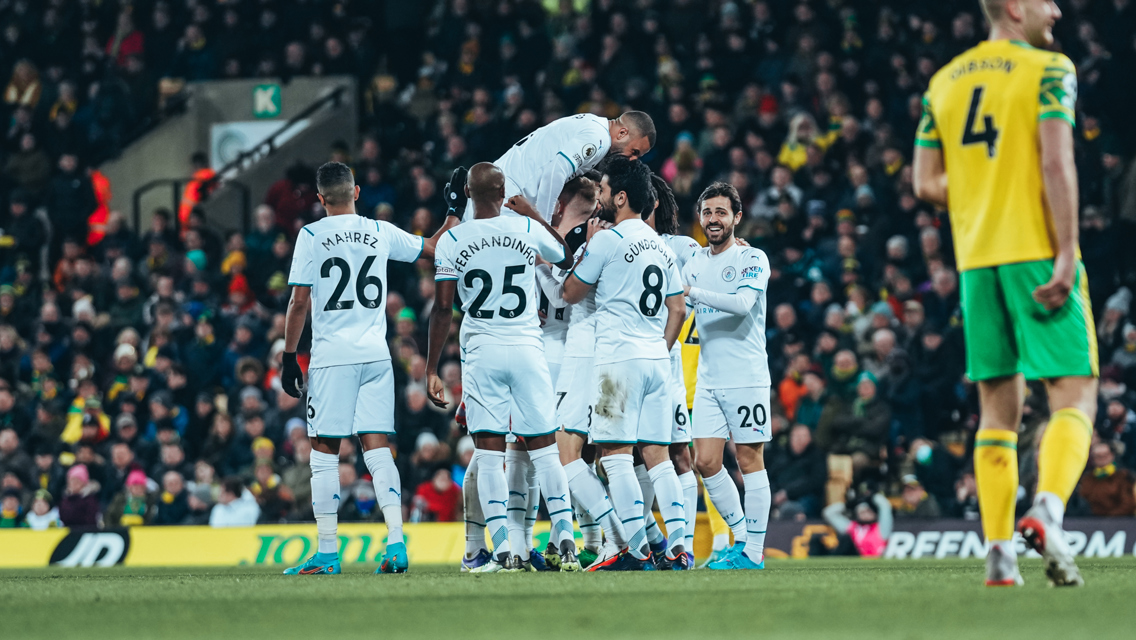 MAKE THAT TWO: Foden is mobbed after doubling the lead early in the second half.