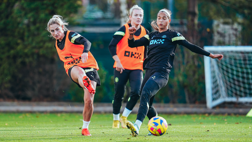 BATTLING HARD : Laura Coombs evades challenges to pass the ball