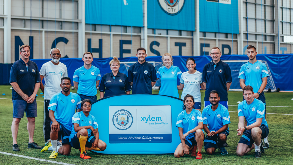 TEAMWORK : Man City staff, Xylem volunteers and City Football Schools coaches join Young Leaders for the football session