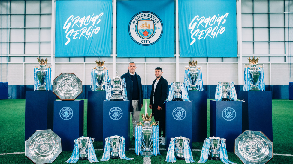 GRACIAS, SERGIO : Record goalscorer Sergio Aguero poses for photos with Khaldoon Al Mubarak and his career trophy haul at City ahead of his final match at the Etihad Stadium, 22nd May 2021.