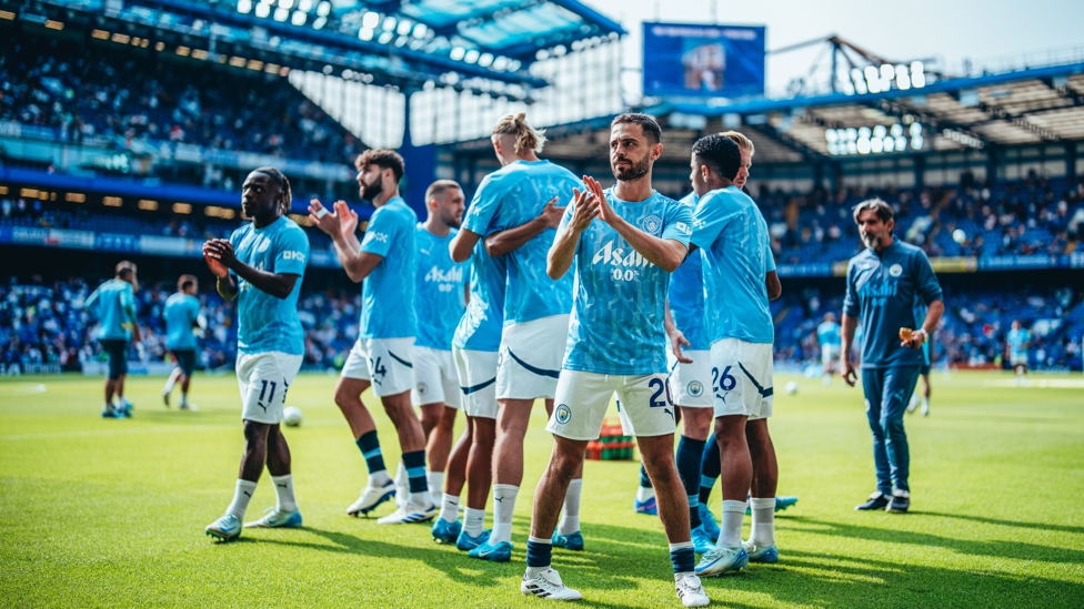 APPLAUD : The players applaud the fantastic travelling fans ahead of the game.