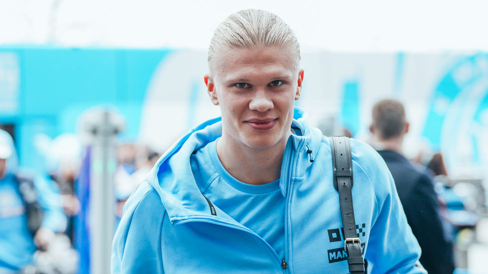 ALL SMILES: Erling Haaland arrives off the team coach, in a spirted mood!