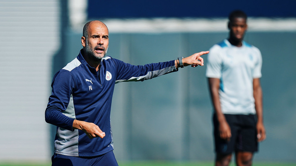 THE BOSS: Pep Guardiola gets his point across to the City players