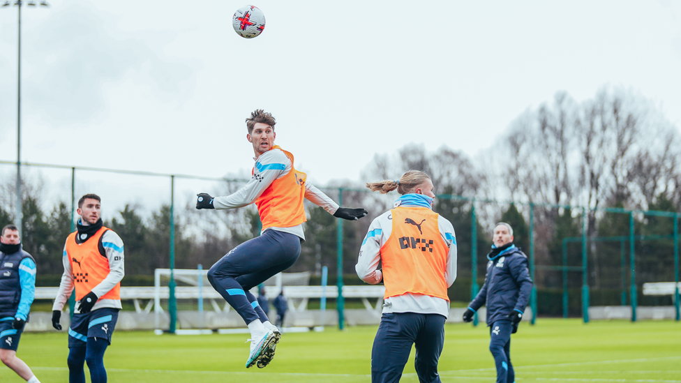 HIGH RISE : John Stones wins a header