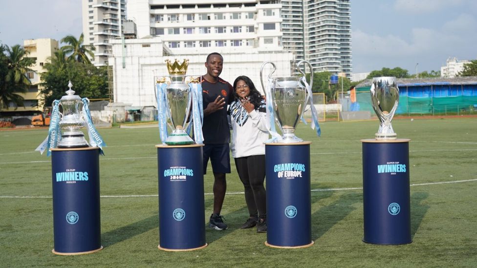 TROPHIES: Zoya and Nedum celebrate a successful community football festival