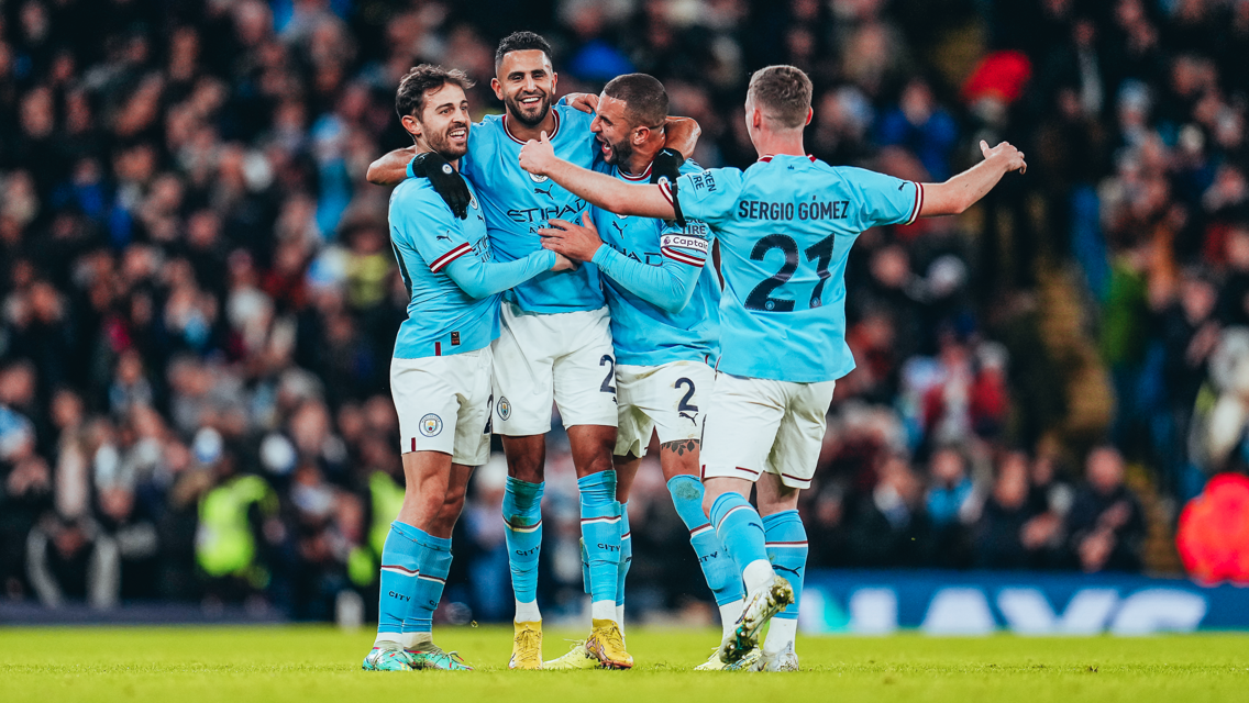 ALL SMILES: The players show their delight after the splendid goal.