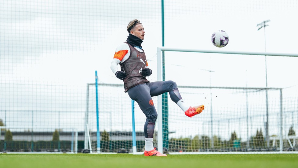 BRING IT DOWN : Jack Grealish controls a high ball