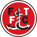 https://www.mancity.com/meta/media/2d2azjpt/1920px-fleetwood_town_f-c-_logo-svg.png