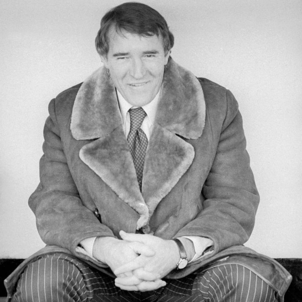 LEADING MAN: Allison is all smiles as he sits in the Maine Road dugout