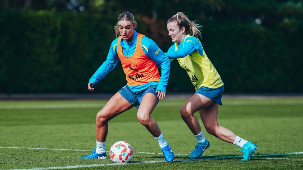 ON THE BALL : Jill Roord and Lauren Hemp tussle for possession