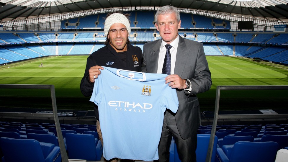 HERE COMES CARLOS  : Tevez was up next, the striker pictured alongside former manager Mark Hughes. 