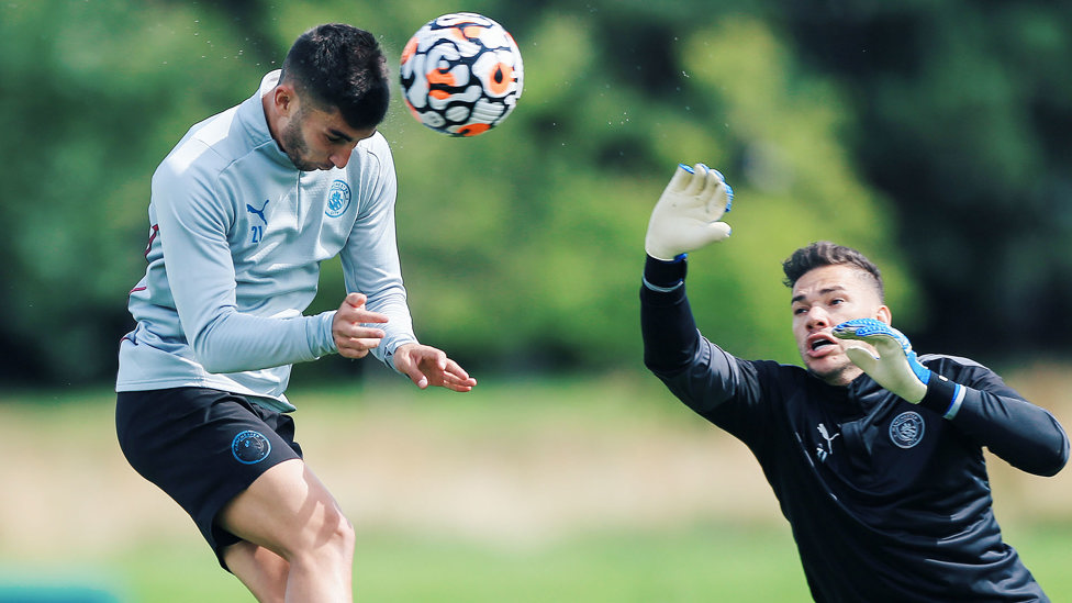 HEADY HEIGHTS: Ferran Torres battles for an aerial ball with Ederson