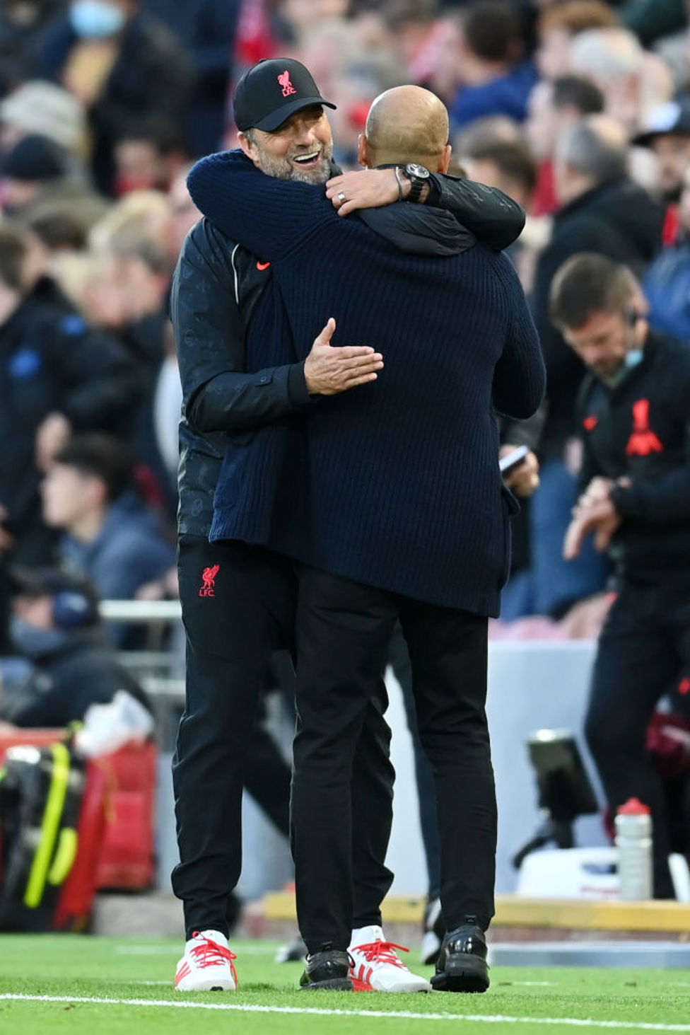 SPOILS SHARED : Guardiola and Klopp end with a hug - points shared.