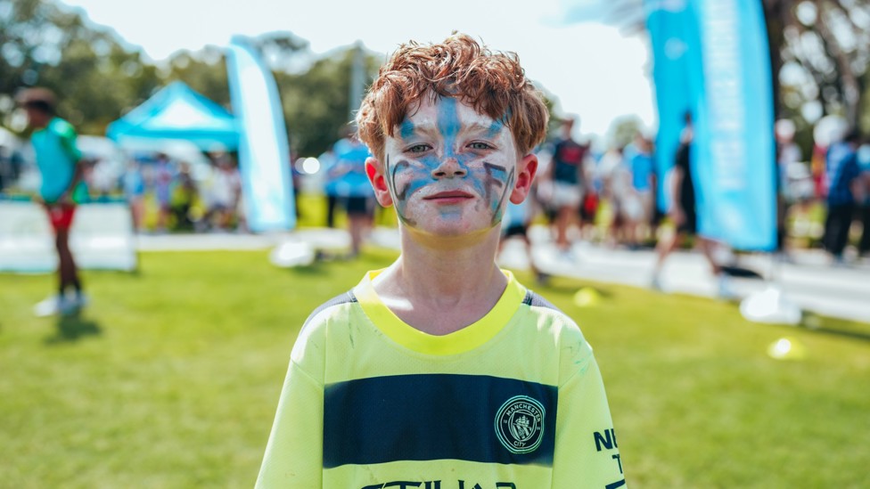 BLUE THROUGH AND THROUGH  : A young City fan showcases his work-of-art face paint. 