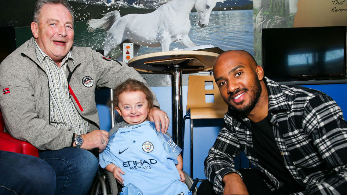 SPECIAL MOMENT: Fabian Delph meets one of brave youngsters at the unveiling of the Royal Manchester Children's Hospital's 3D pain distraction unit