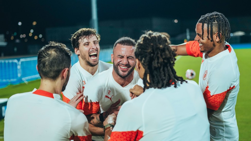 ALL SMILES : Kyle Walker is mobbed by his team-mates