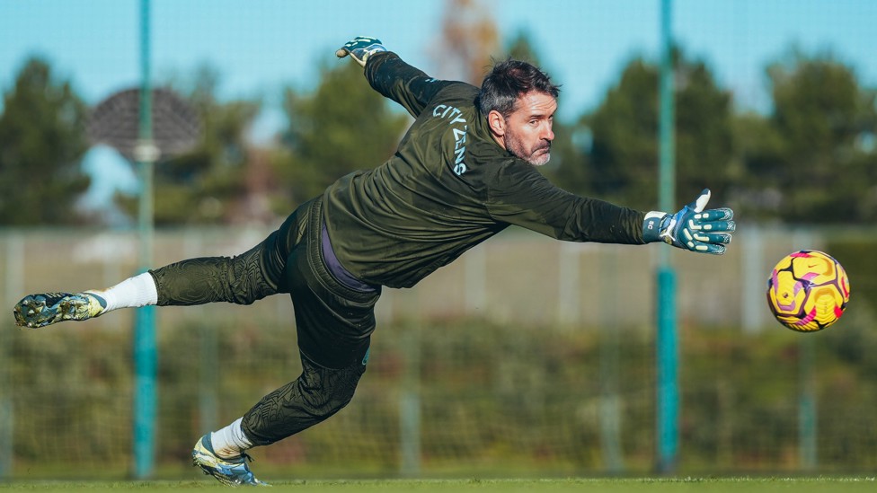 SHARP REFLEXES : Scott Carson gets down to his right