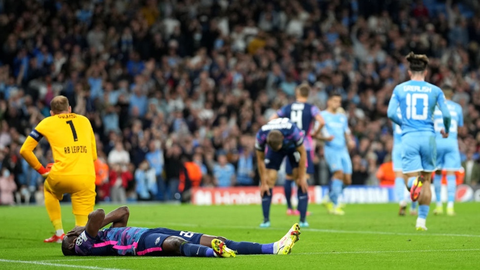 DOUBLE TROUBLE : Mukiele nods De Bruyne's vicious cross into his own net to make it 2-0.