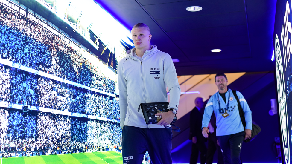 ARRIVAL : Haaland makes his way to the dressing room.