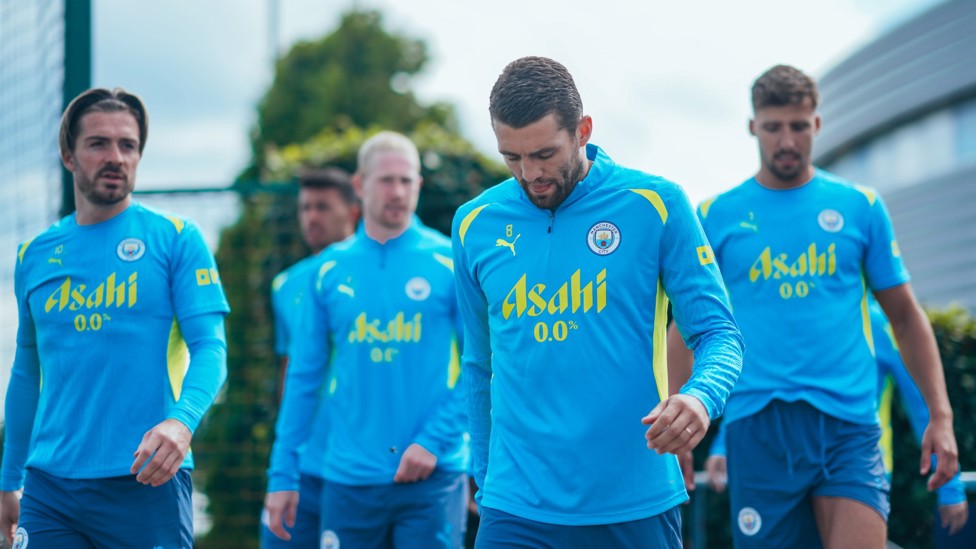 HEADING OUT : The players make their way out to the training pitches.