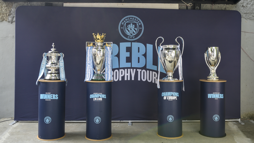 TROPHIES : The community visit to Bandung forms part of the Club’s Treble Trophy Tour.