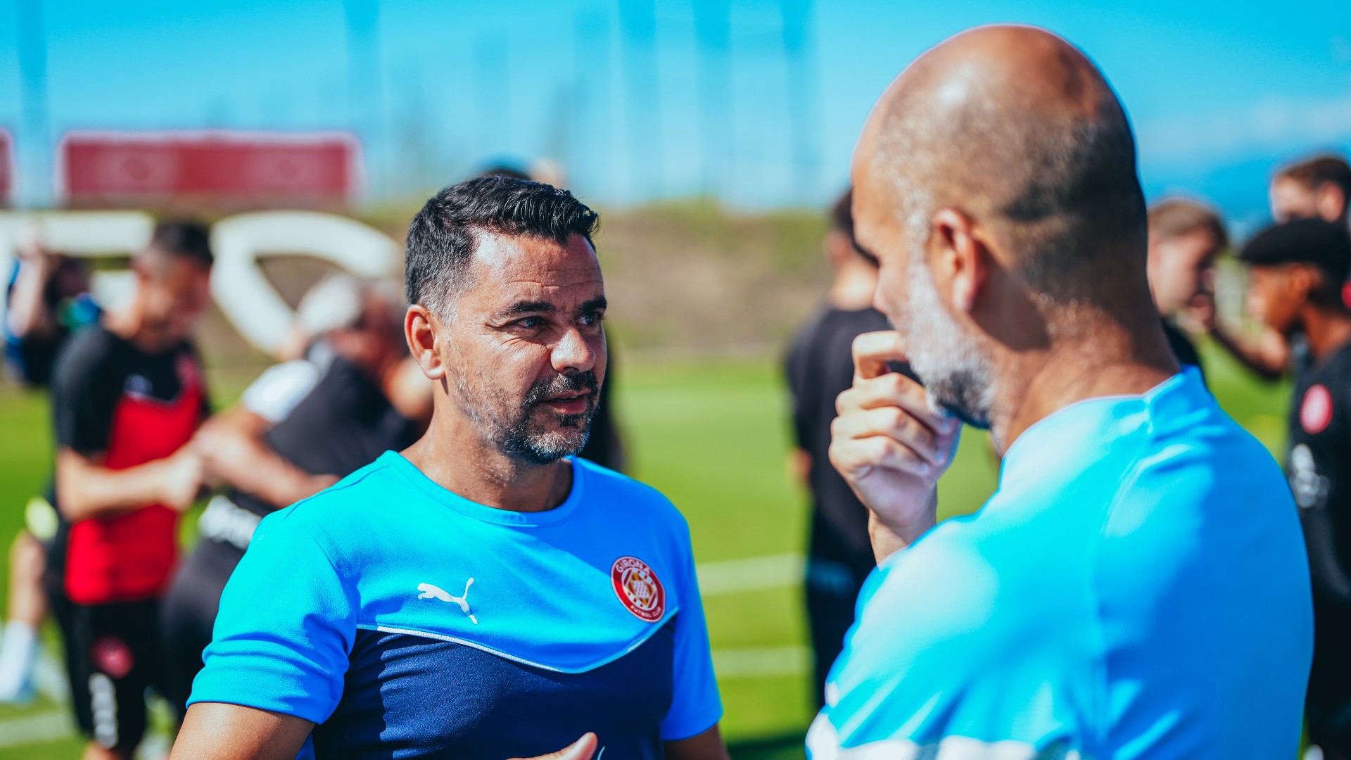 MEETING OF MINDS : Girona manager Michel speaks with Pep Guardiola