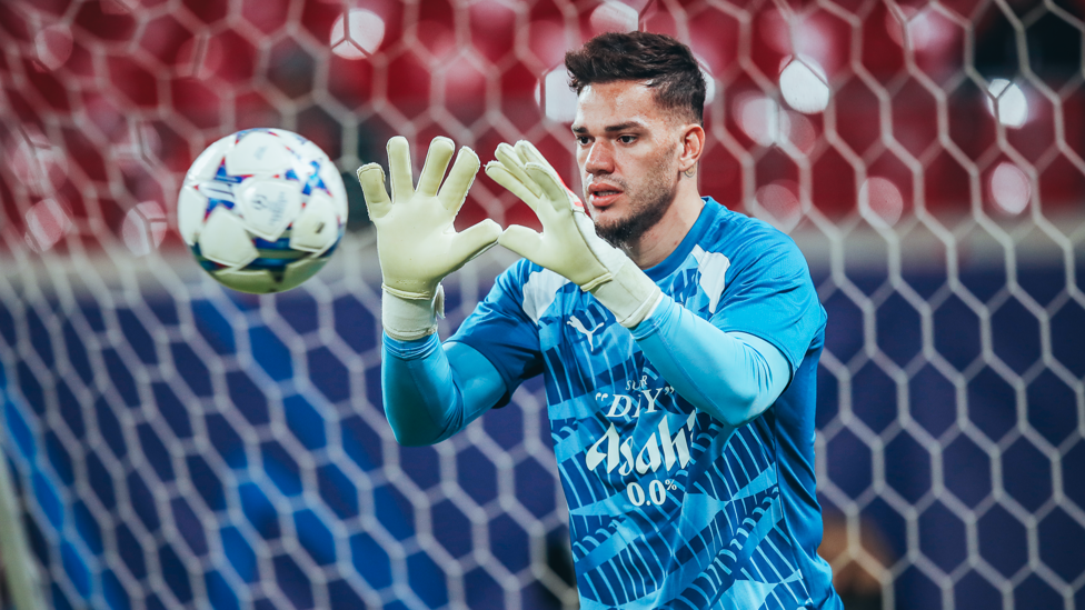 SAFE HANDS : Ederson gets a feel of the ball during the pre-match warm up.