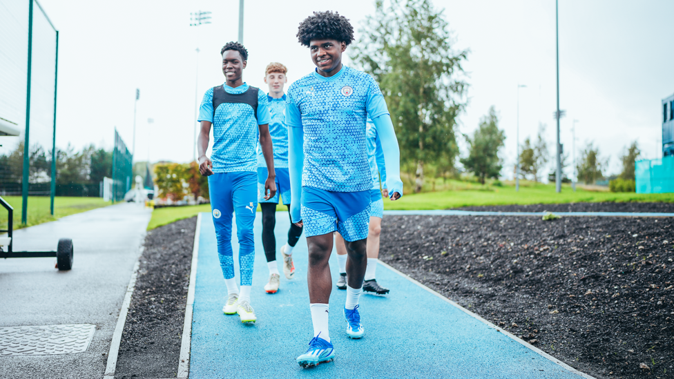 ON THEIR WAY : Jaden Heskey leads his team-mates out on to the training pitch