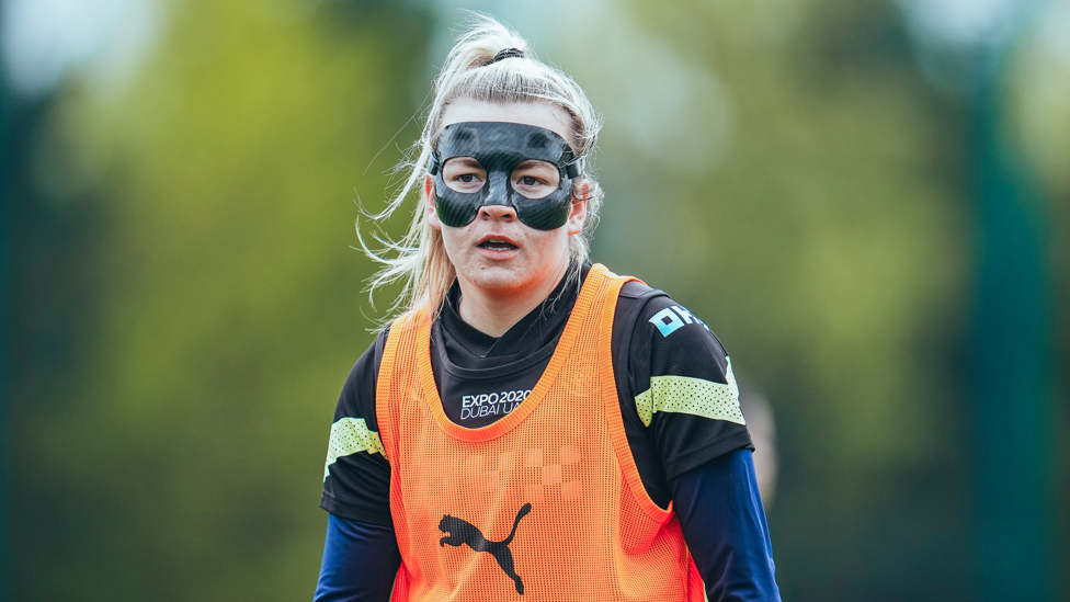 MASKED WINGER : Lauren Hemp masked up and ready to train.