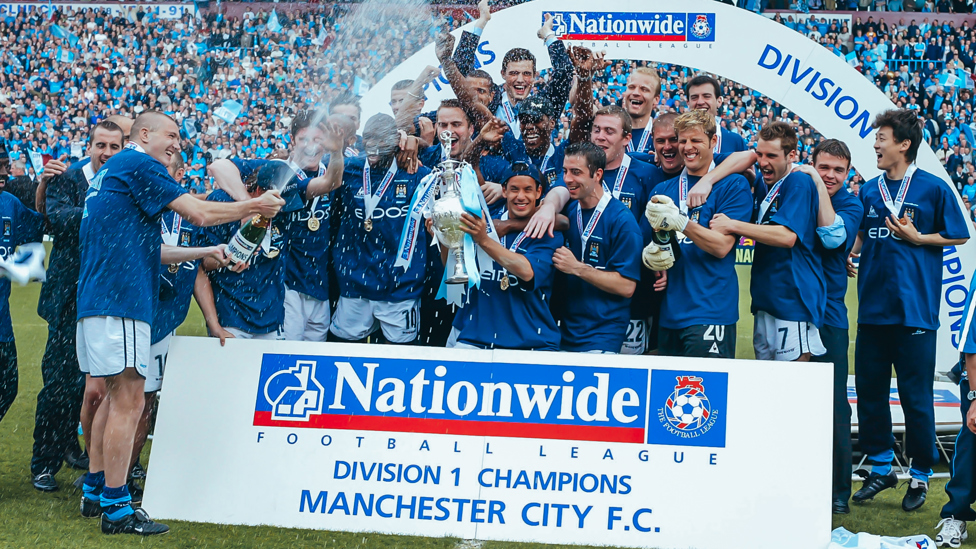 SQUAD GOALS : The team celebrate with the Division One trophy | 21 April 2002.