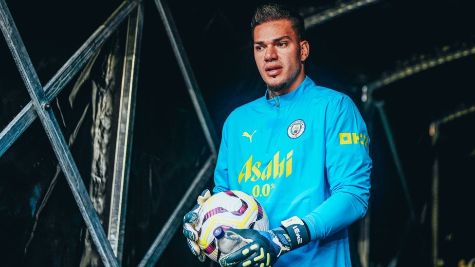 PREP TIME : Ederson heads out on to the Molineux pitch ahead of kick-off