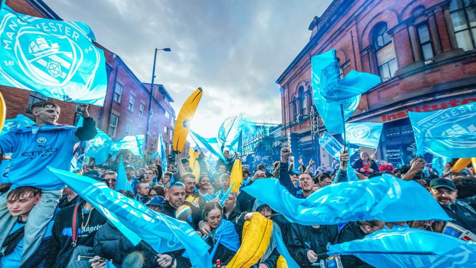 TAKING OVER : City fans line the streets of Manchester for the end of season parade