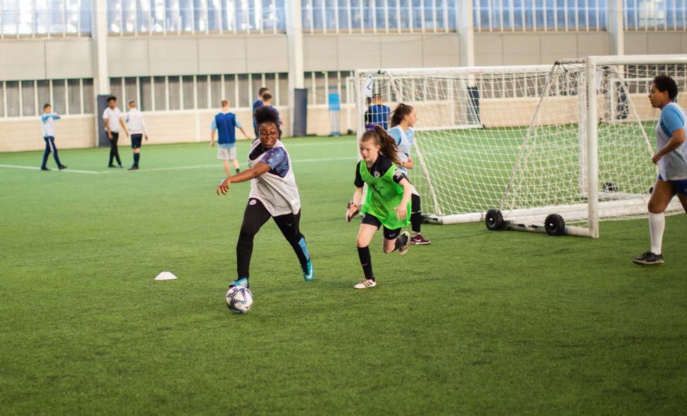  : Youngsters making use of the indoor pitch