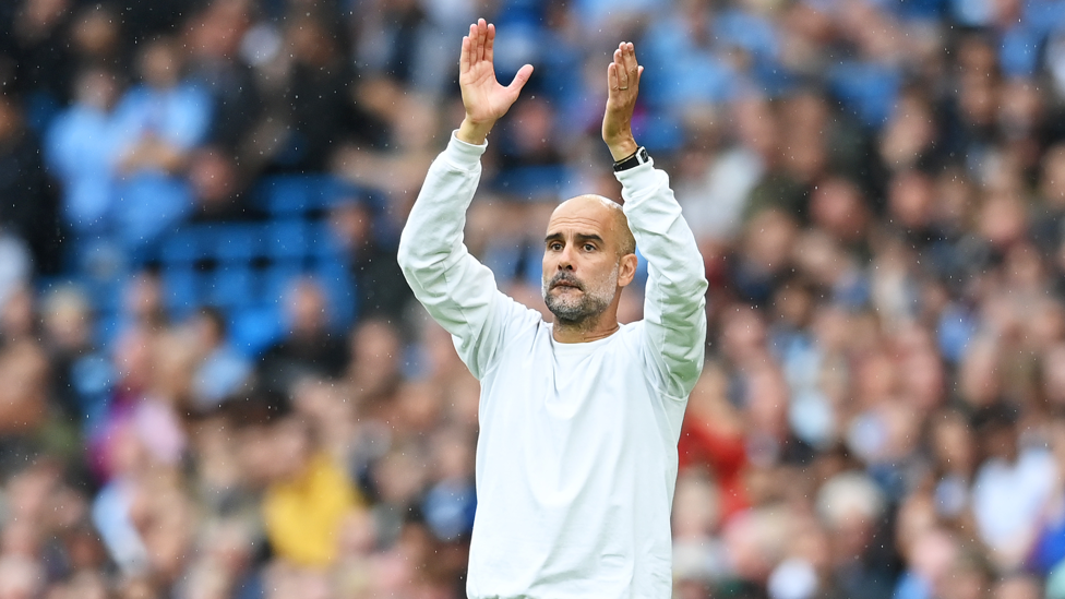 SEAL OF APPROVAL : Pep Guardiola applauds his players' efforts