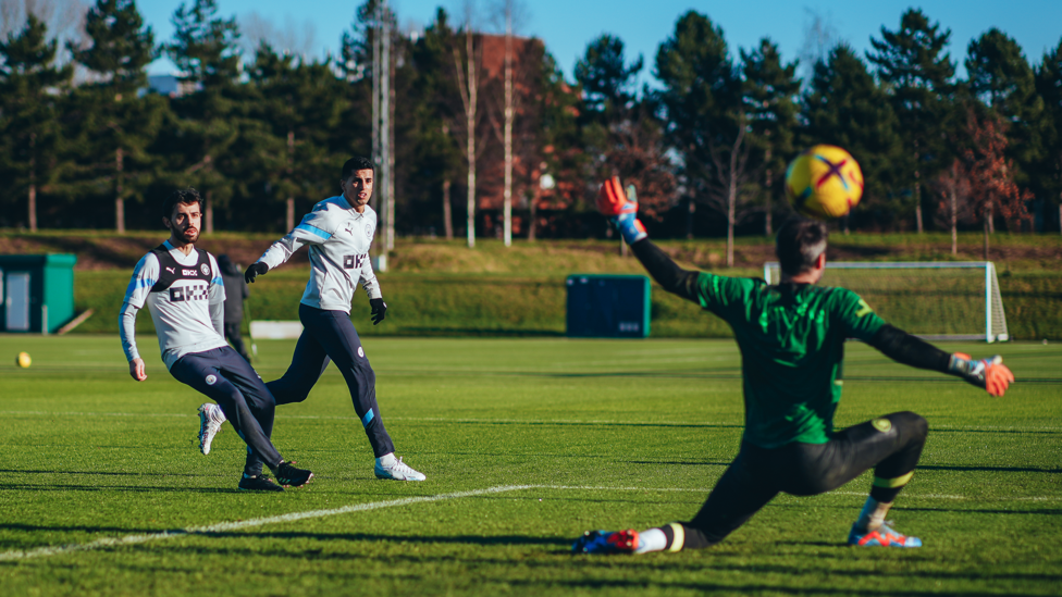 ALL FIRED UP: Bernardo Silva and Joao Cancelo watch as a shot fizzes past Scott Carson.