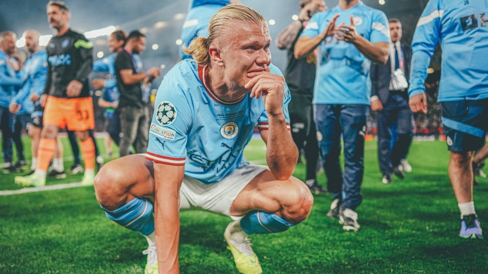 EUROPEAN CHAMPION : Erling Haaland soaks it all up as he realises he's just helped City win the UEFA Champions League