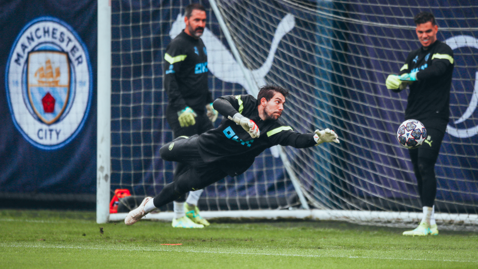 FULL STRETCH : Stefan Ortega Moreno dives for a shot while Scott Carson and Ederson watch on