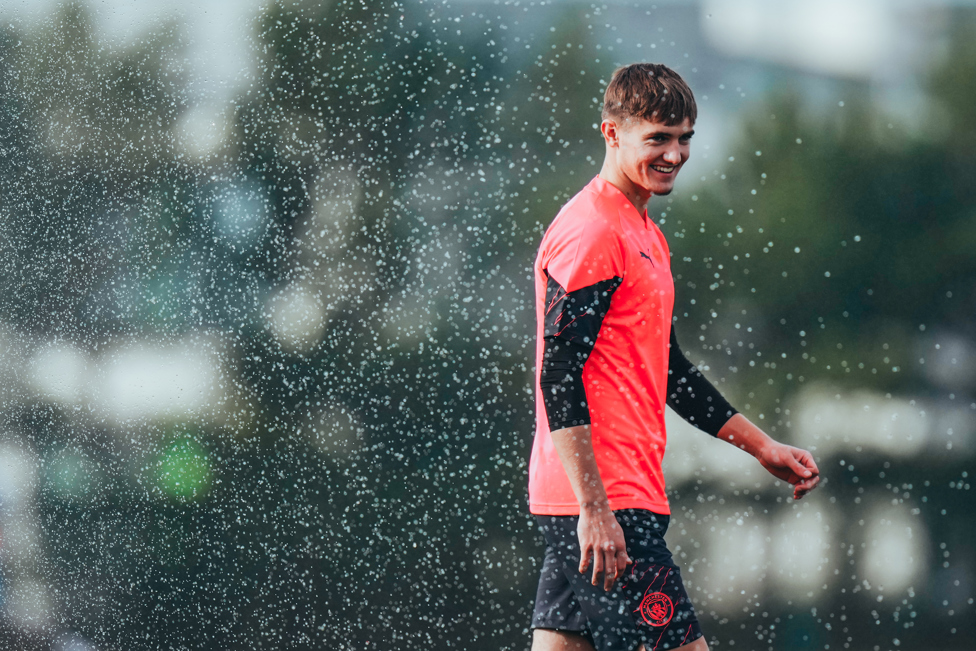 MAKING A SPLASH : Jacob Wright gets caught by the sprinkler!