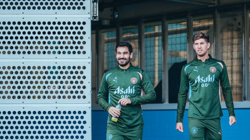 REPRTING FOR DUTY: Ilkay Gundogan and John Stones step out for Monday's session.