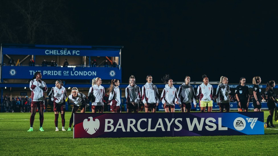 HERE WE GO : The players line up ahead of kick-off