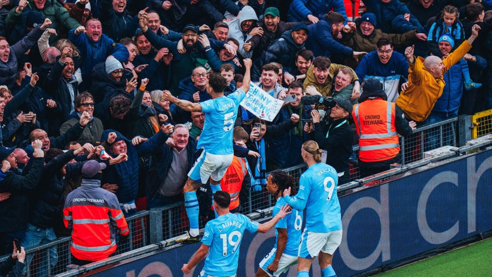 SUPER STONES : John Stones celebrates with the fans after his goal at Liverpool